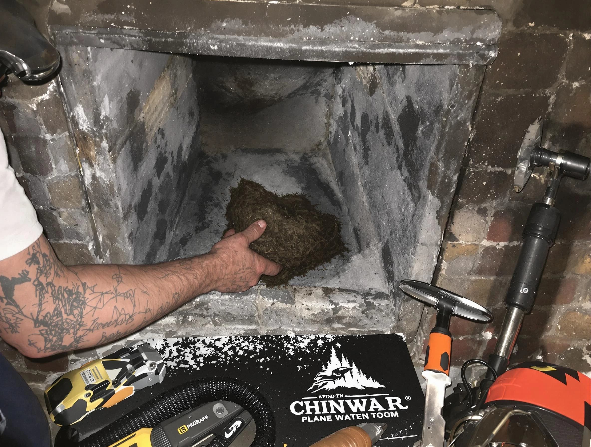 Newark Chimney Sweep safely removing debris and screening chimney in Newark, NJ